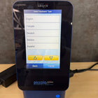 Portable Abaxis Piccolo Express analyzer displaying test cartridge insertion slot