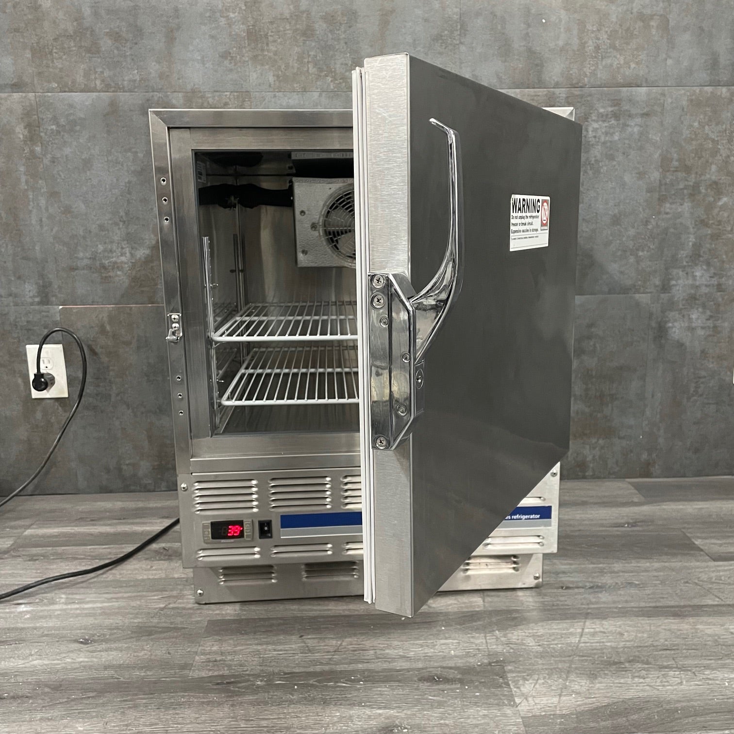 Follet R4 ADA Compliant Refrigerator with the stainless steel door half open
