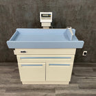 Used Midmark pediatric exam table with built-in infant measuring arm and digital scale Price