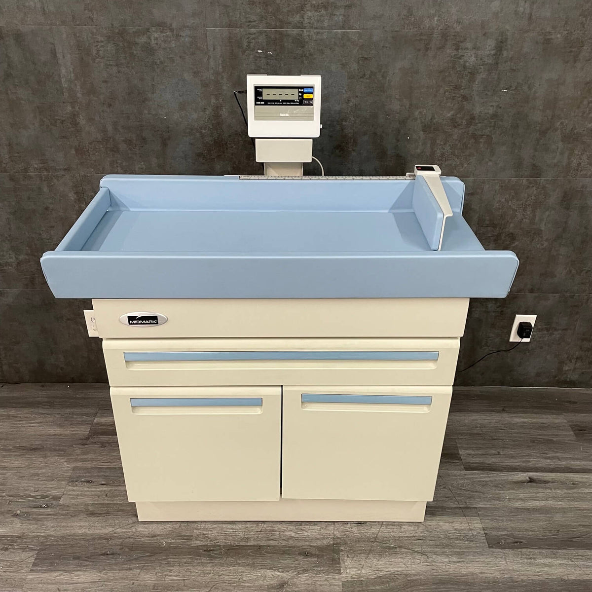 Used Midmark pediatric exam table with built-in infant measuring arm and digital scale Price