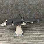 Used Reliance 710 exam chair fully reclined with arms up - procedure chair for sale near me