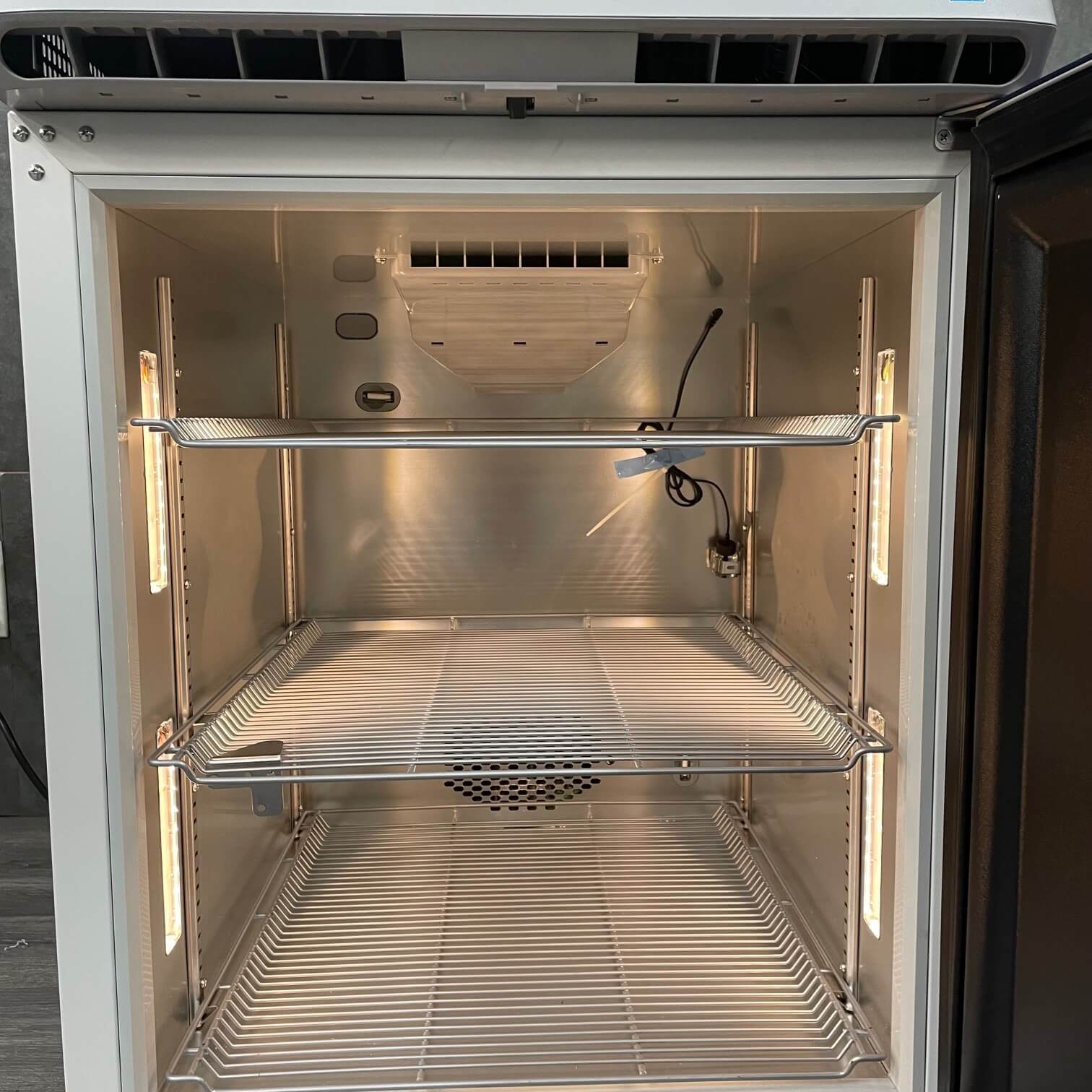Thermoscientific TSX505SA 5.5ft undercounter refrigerator at Angelus Medical showing the inside cleaned and looking like new