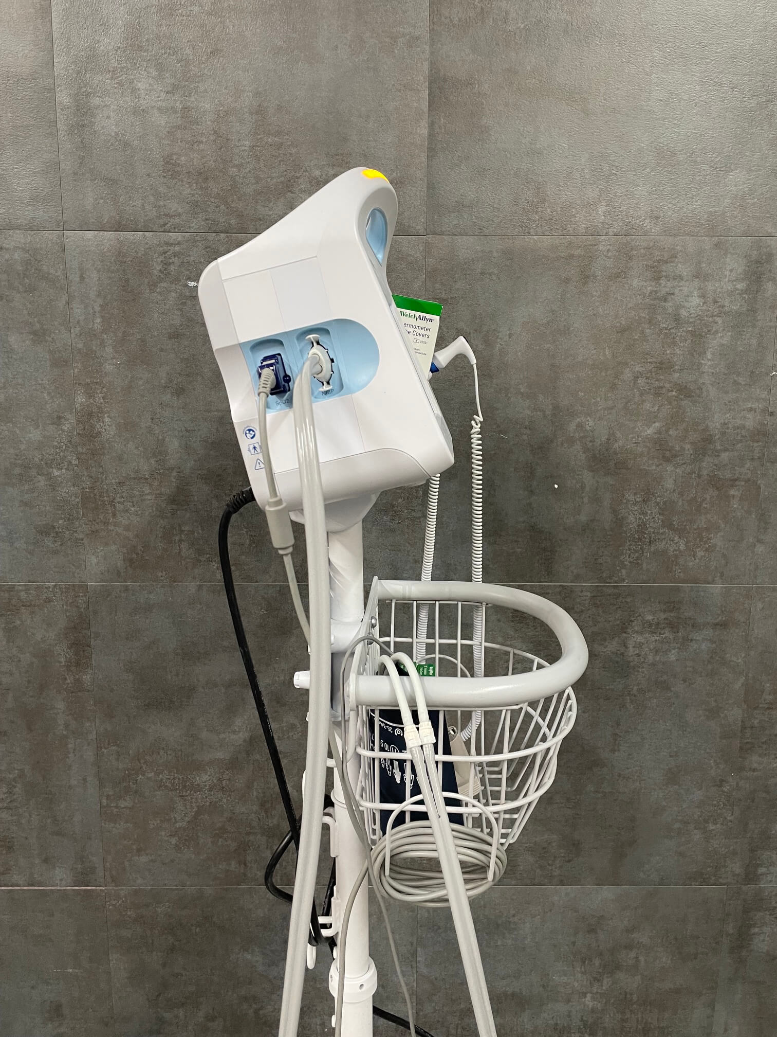 Healthcare professional using Welch Allyn 6000 Series monitor during patient assessment - near me for sale
