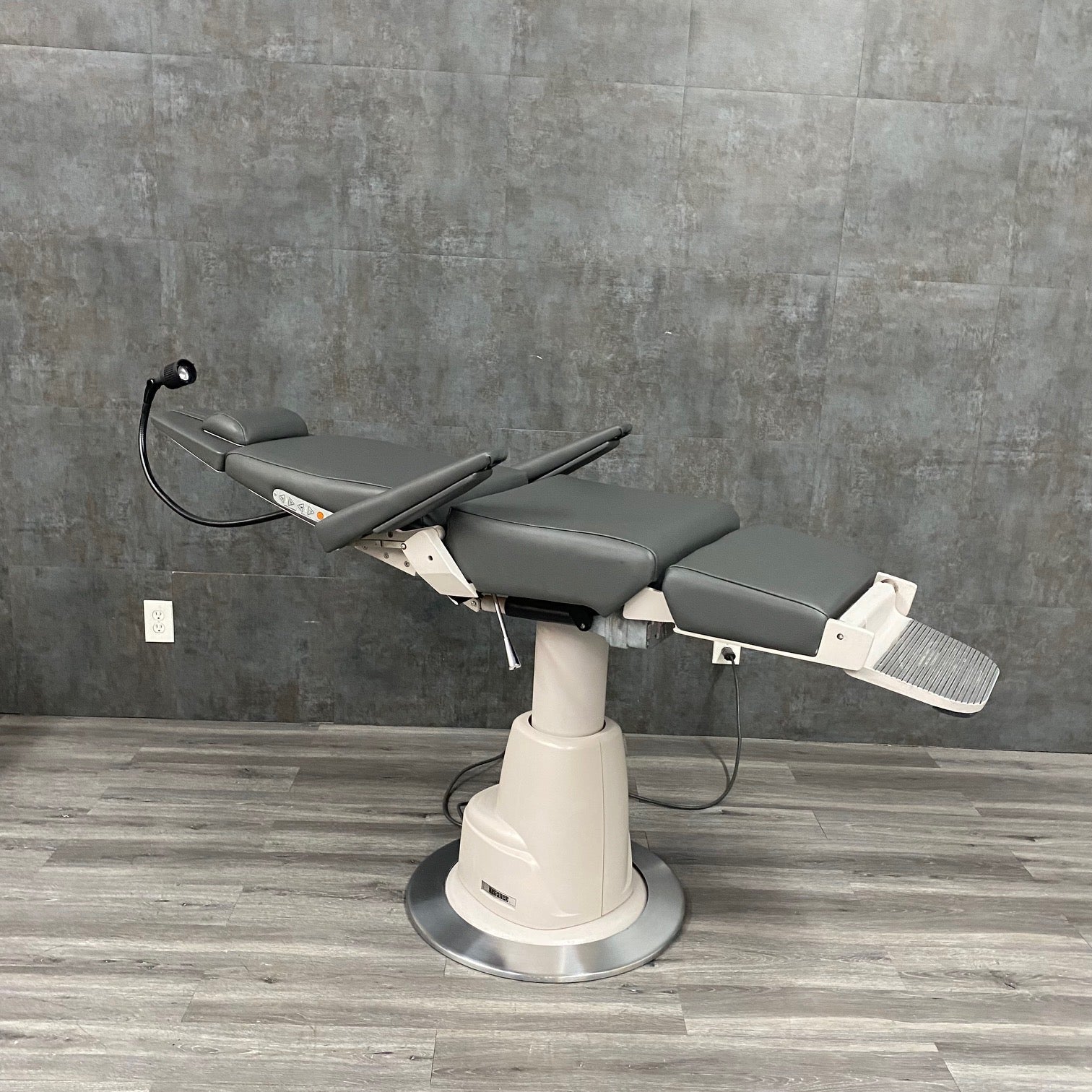 Side view of Reliance 710 exam chair with motorized recline and adjustable positioning - for sale near me