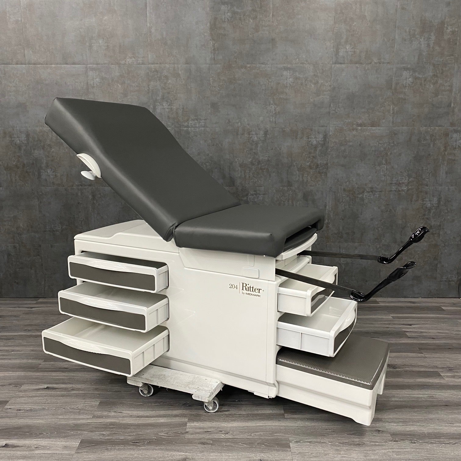 Buy Midmark Ritter 204 exam table near me - With Stirrups and Black Top at Angelus  Medical