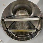 Large stainless steel chamber inside Tuttnauer 3870EA autoclave with instrument trays - For Sale Near me